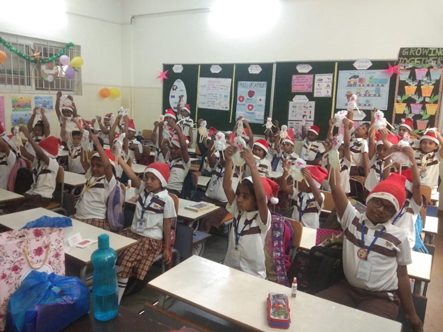 Children of  classes 1 and 2 were asked to bring a Christmas hat and a few decor pieces, such as candles, snowman, an X-mas tree, tree toppers, and tree hangings, in order to celebrate the festival of Christmas.