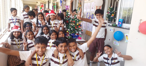 Children of  classes 3-5 regaled in the joy of celebrating Christmas.